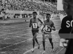 Oromo  (Oromian) athletes Abebe Bikila (L) and Mamo Wolde Dagaga  (R) in exhibition race at Berlin Olympic Stadium. (Photo by Robert Lackenbach.The LIFE Picture Collection.Getty Images)