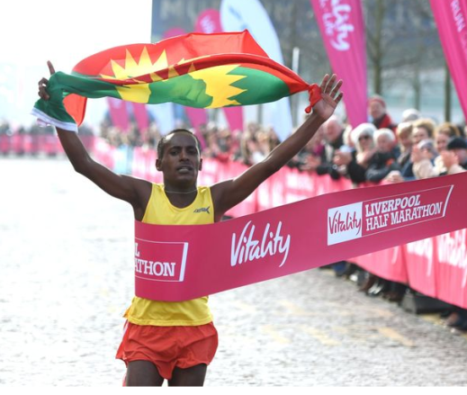 Oromo athlete Dejene Gezimu clinches victory in the 2016 Vitality Liverpool Half Marathon