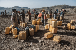 Ethiopians wait to fill water cans in February during the recent drought. With the return of the rains, however, have come flooding and disease — something the government is reluctant to discuss. (Aida Muluneh for The Washington Post)