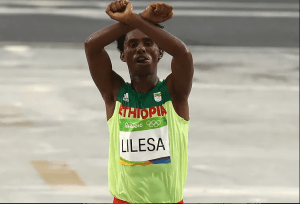 Fayyisaa lalisaa Oromo national hero, at Rio 2016 Olympicmarathon in the podium, finishing line in #OromoProtests as winning theOlympic medal, 21 August 2016