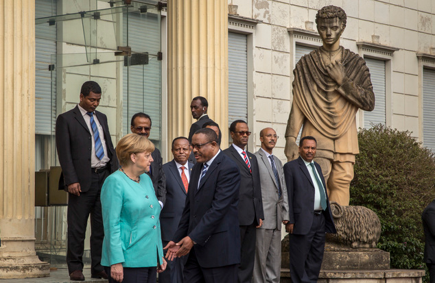 angela-merkel-refused-a-handshake-when-faced-hailemariam-dessalegn-no-photo-opportunity-for-the-fascist-in-finfinne-oromia-ethiopia-october-11-2016-africa-visit