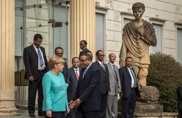 angela-merkel-refused-a-handshake-when-faced-hailemariam-dessalegn-no-photo-opportunity-for-the-fascist-in-finfinne-oromia-ethiopia-october-11-2016-africa-visit