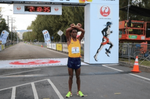 feyisa-lilesa-finished-fourth-in-2016-honolulu-marathon-he-walked-the-last-100-metres-while-making-the-famous-x-gesture-with-his-arms-in-silent-protest